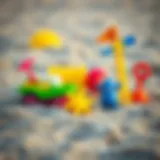 Colorful beach toys in a sandy environment