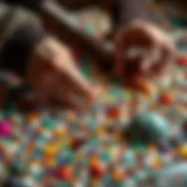 Close-up of hands assembling mosaic pieces